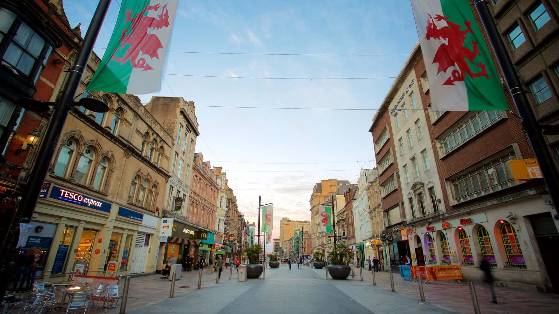 Download Cardiff City Centre Dusk Welsh Flags Wallpaper | Wallpapers.com