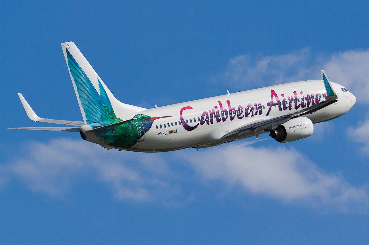 Caribiske Airlines flyver i himlen baggrundsbillede Wallpaper