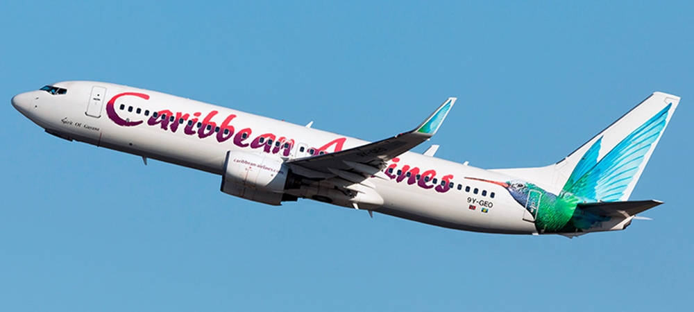 Karibikairlines Flugzeug Steigt In Den Himmel Auf Wallpaper