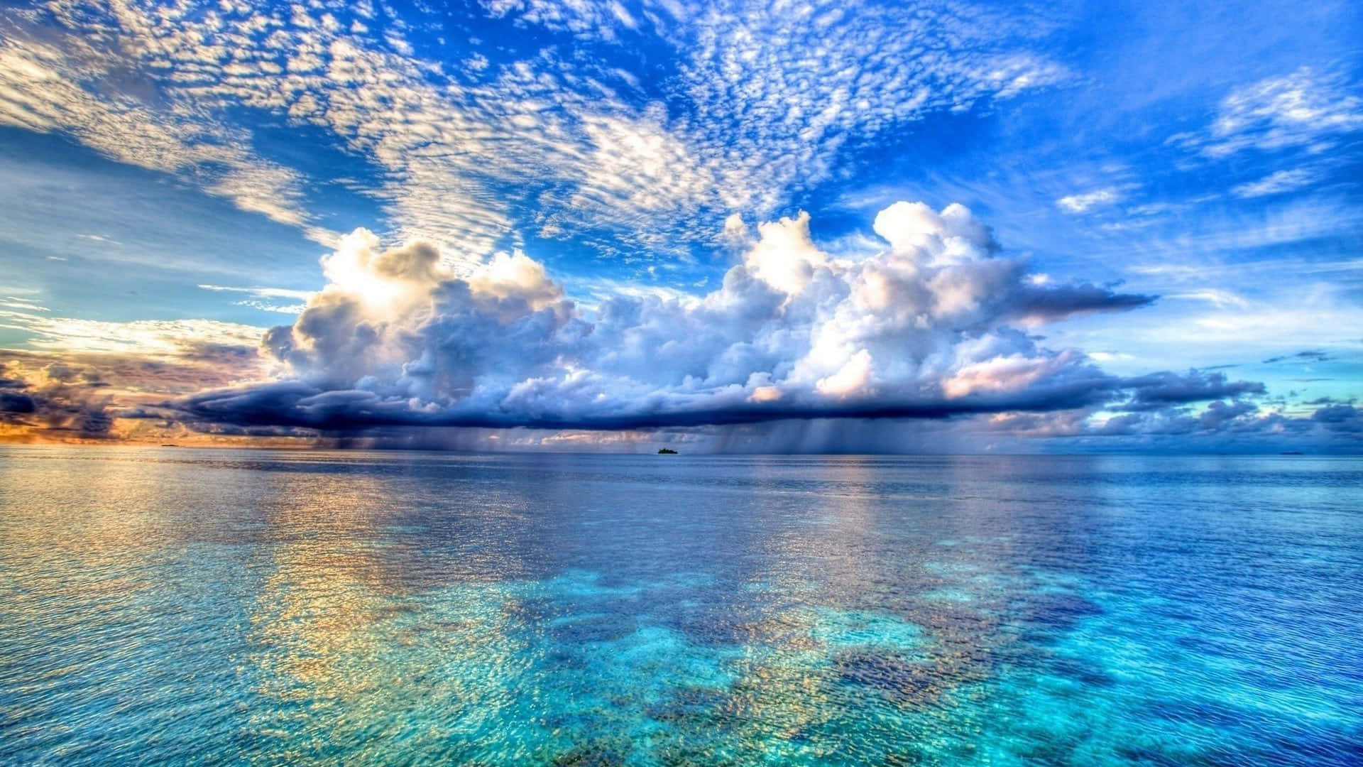 A Cloudy Sky Over The Ocean Wallpaper
