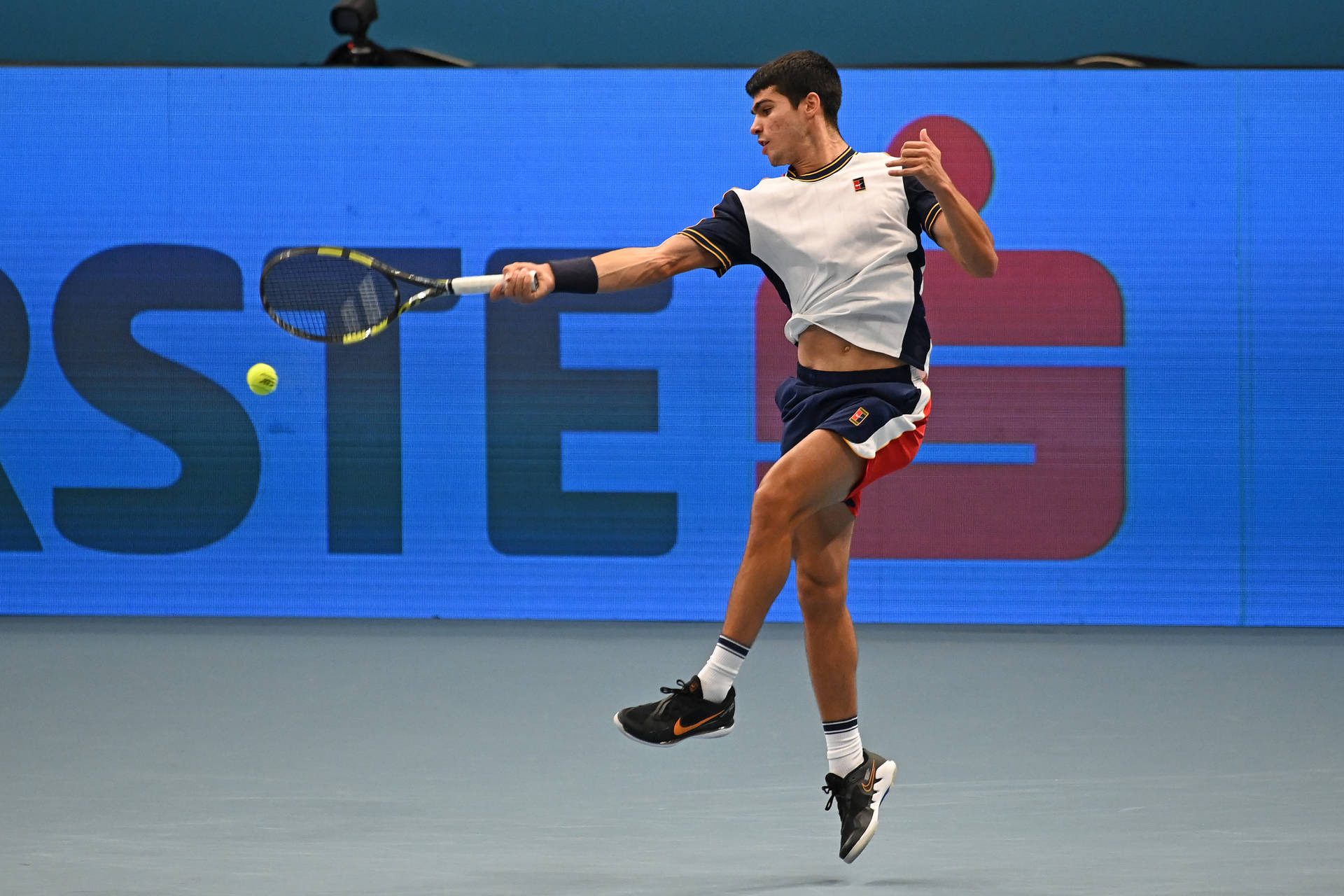 Carlos Alcaraz Jumping In Tennis Court