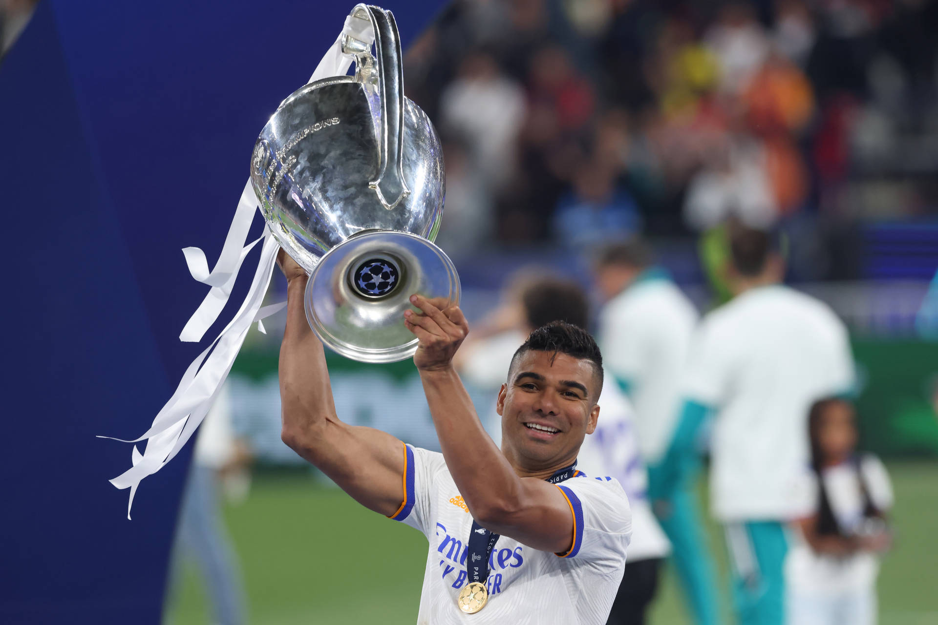Carlos Casimiro Holds Up Trophy Wallpaper