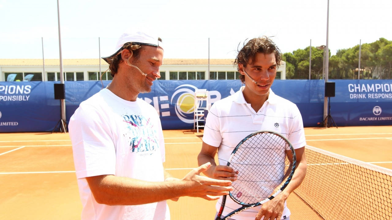 Carlos Moya In Court With Nadal Wallpaper