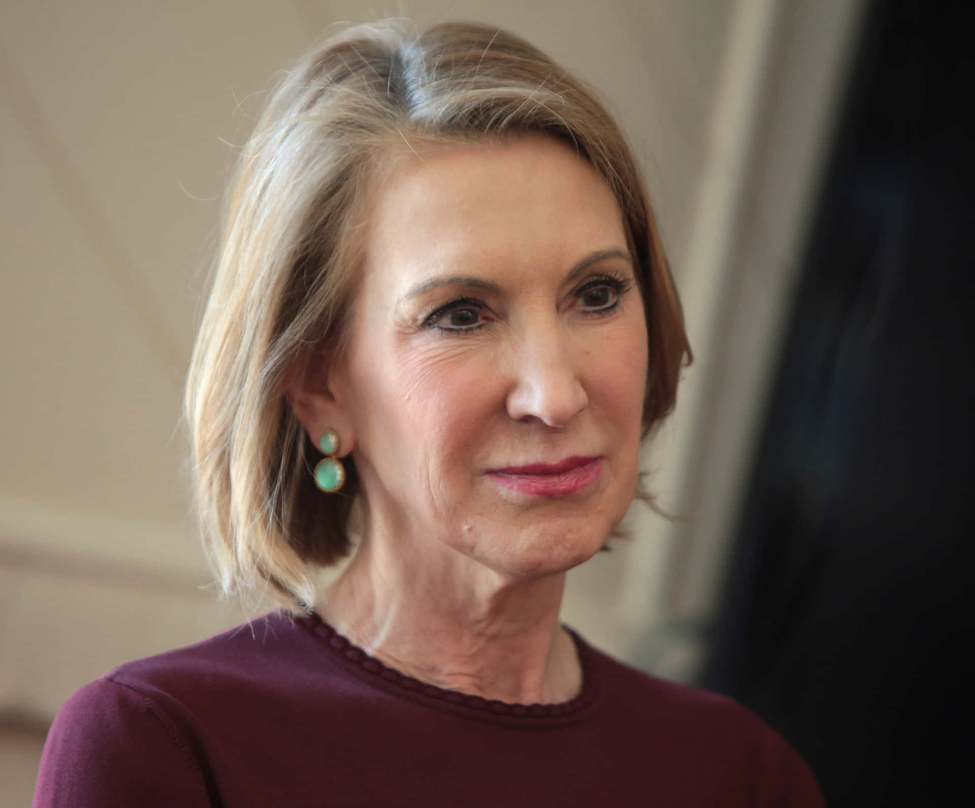 Carly Fiorina With Green Earrings Background