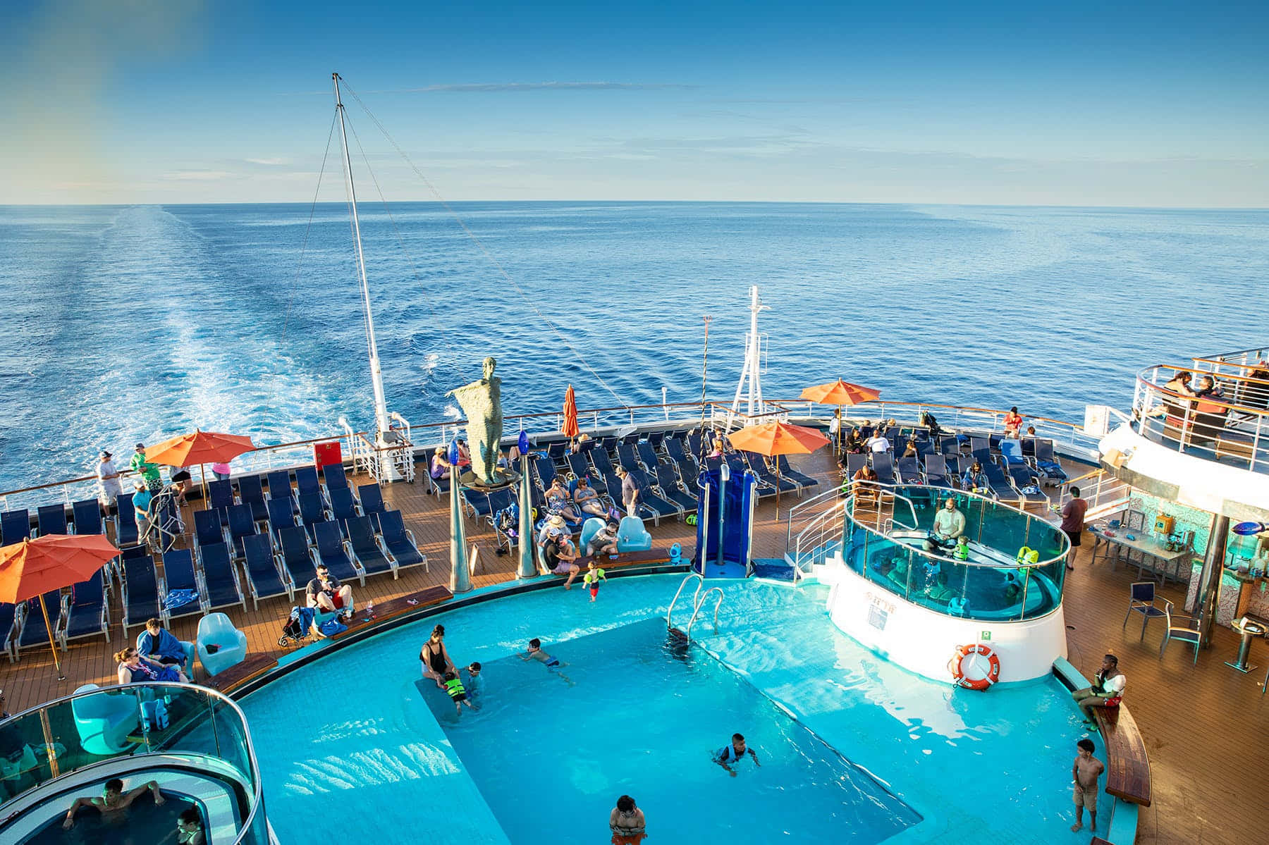 A Cruise Ship With A Pool And People In It