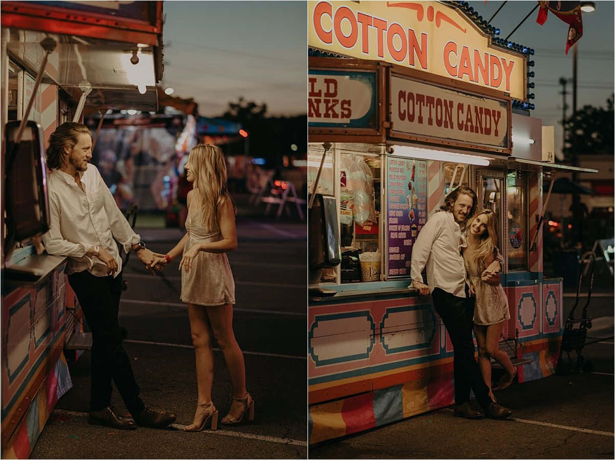 Couple Standing In Front Of Carnival Stand Picture