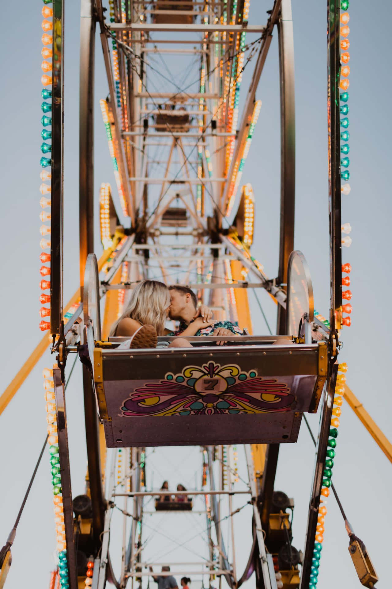 Couple Kissing On Carnival Ferris Wheel Picture