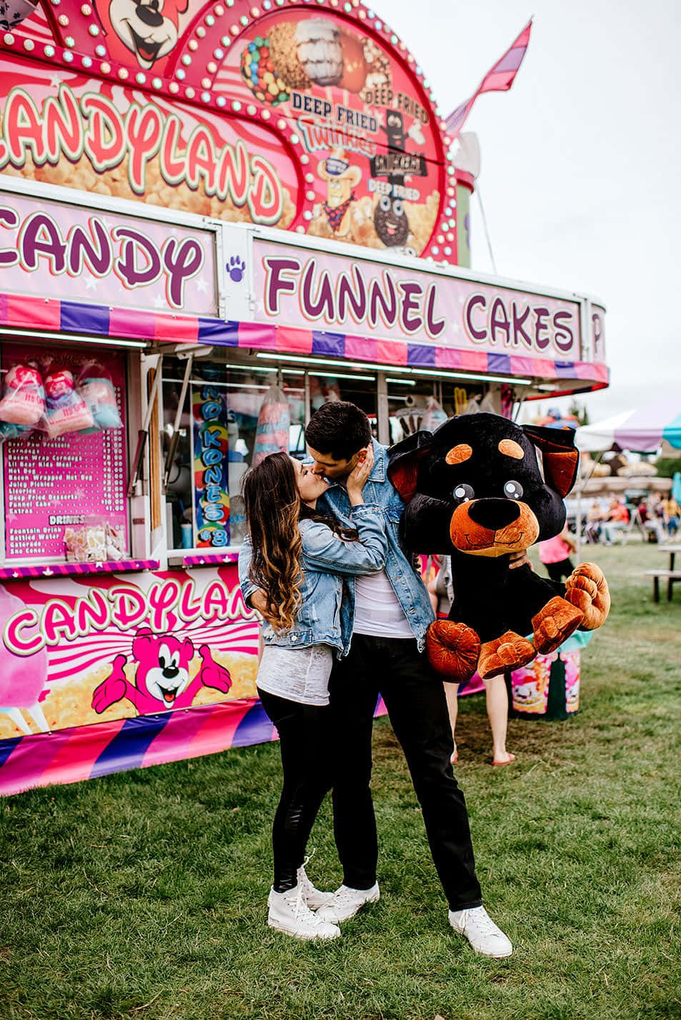 Couple Kissing At Carnival Booth Picture