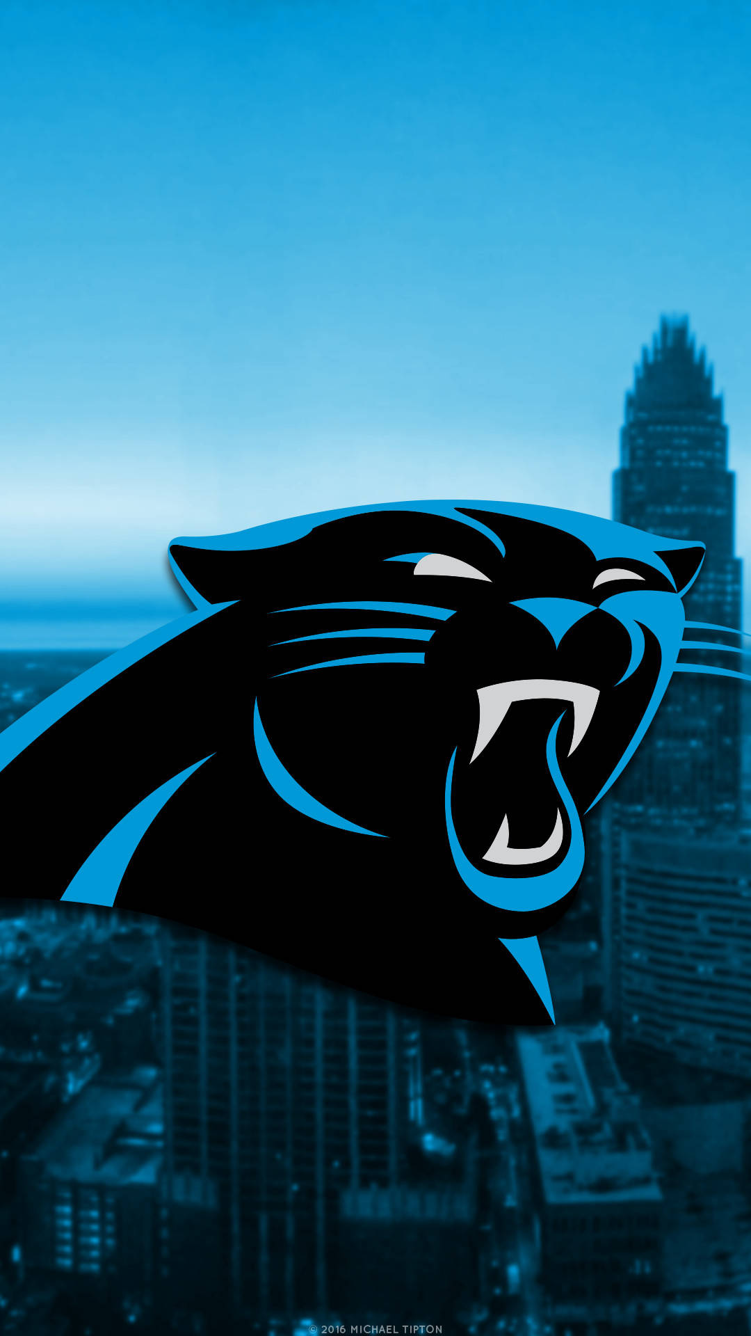 Carolina Panthers Logo On City Background Wallpaper