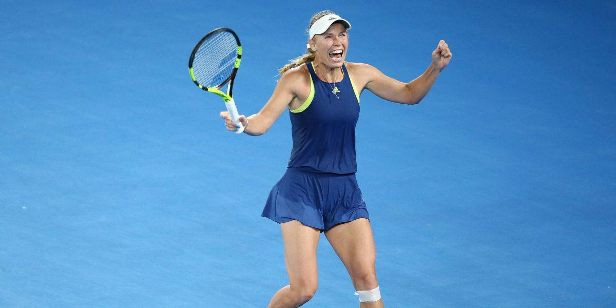 Caroline Wozniacki Winning On Blue Court Wallpaper