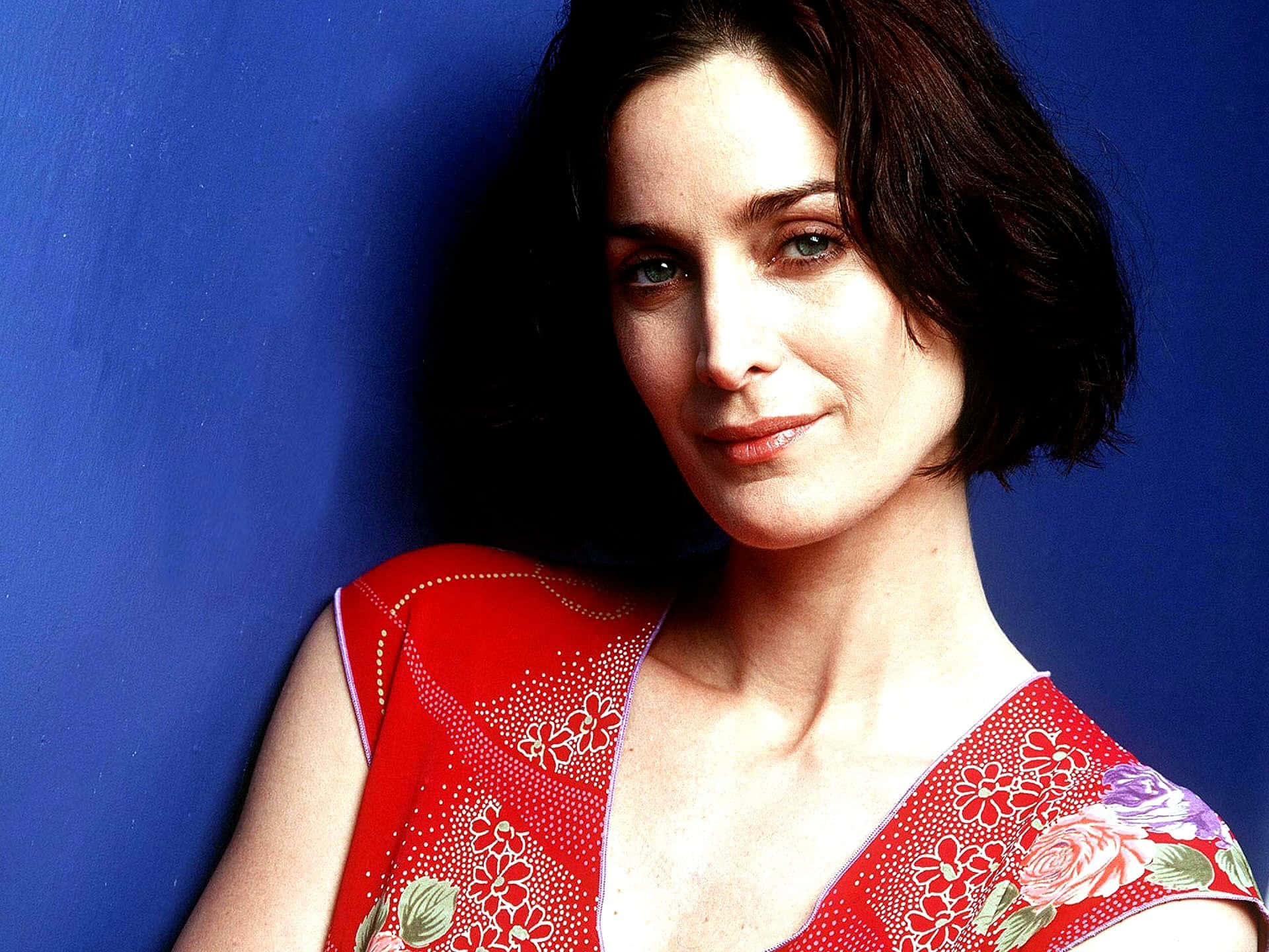 Download Carrie Anne Moss Red Dress Portrait Wallpaper | Wallpapers.com