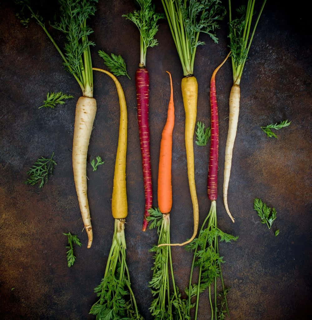 Colorful Carrots On A Dark Background