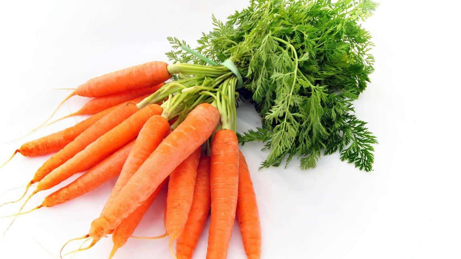 Carrots Are Arranged On A White Surface