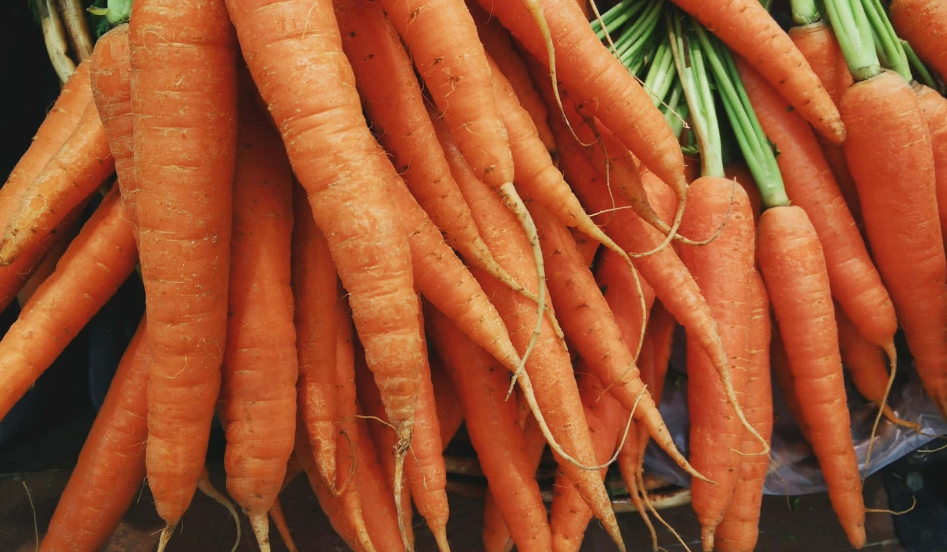 A Bunch Of Carrots In A Basket