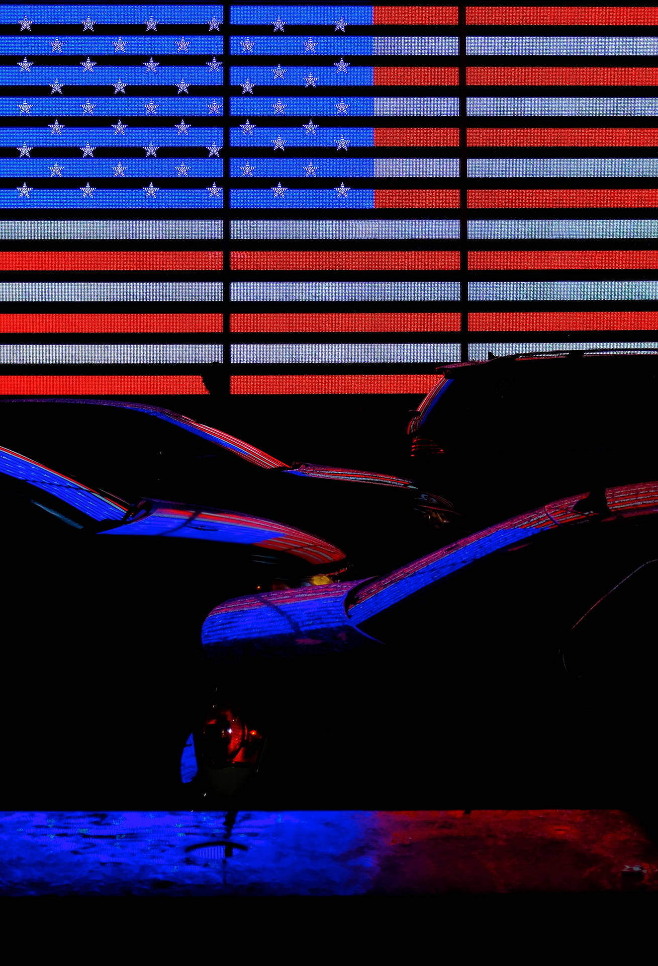 Cars Under Neon American Flag Background