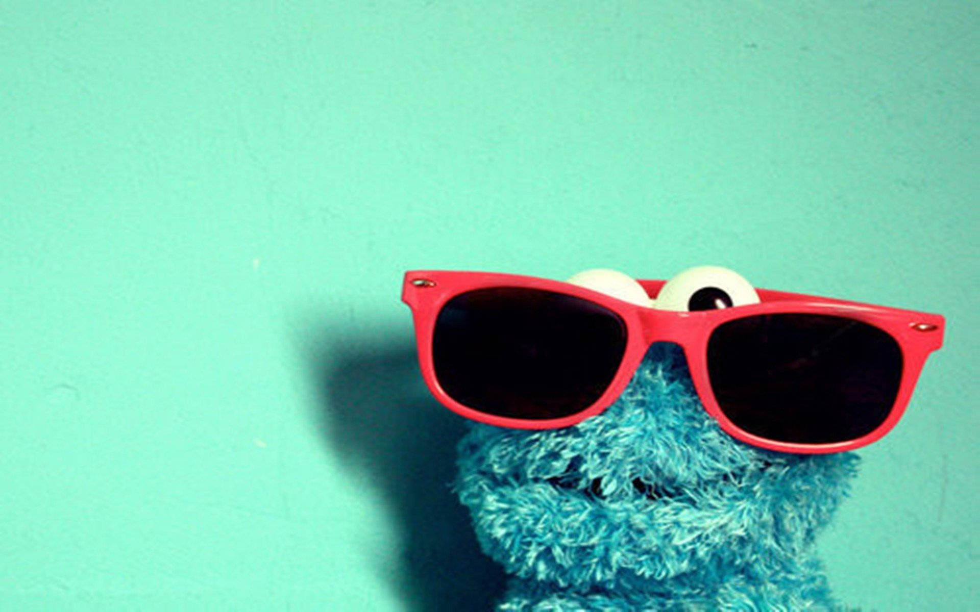 Cartoon Cookie Monster With Red Shades Wallpaper