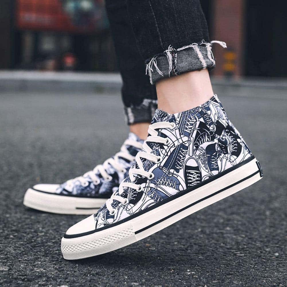 A Person Wearing A Pair Of Sneakers With A Floral Pattern