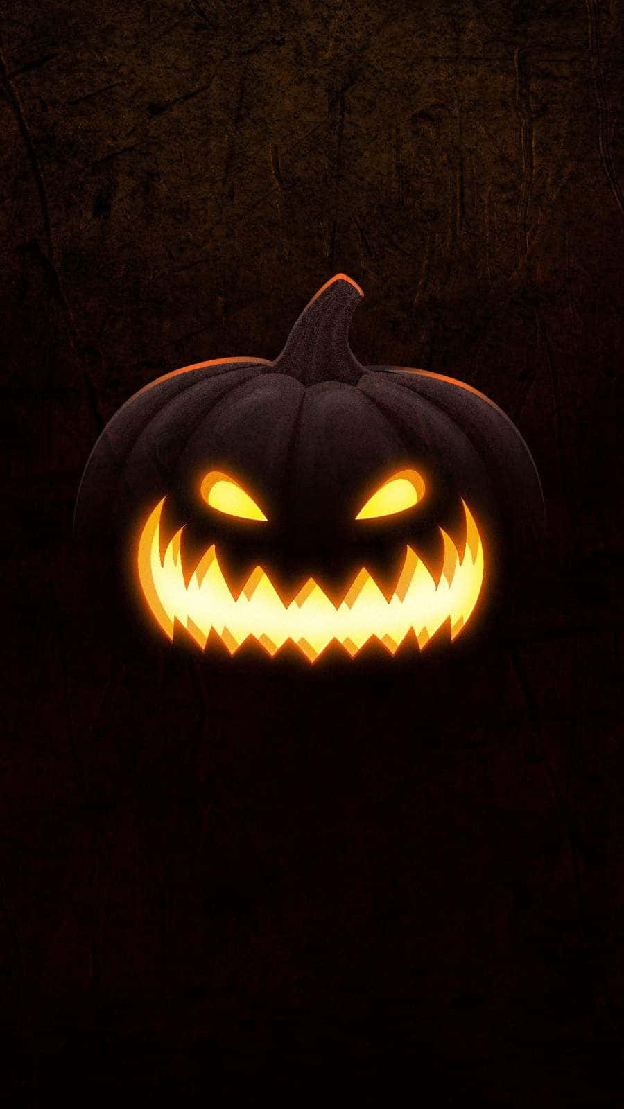 Majestic Carved Pumpkin Glowing in the Night Wallpaper