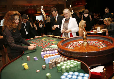 Casino Dealer Conducting A Roulette Wallpaper
