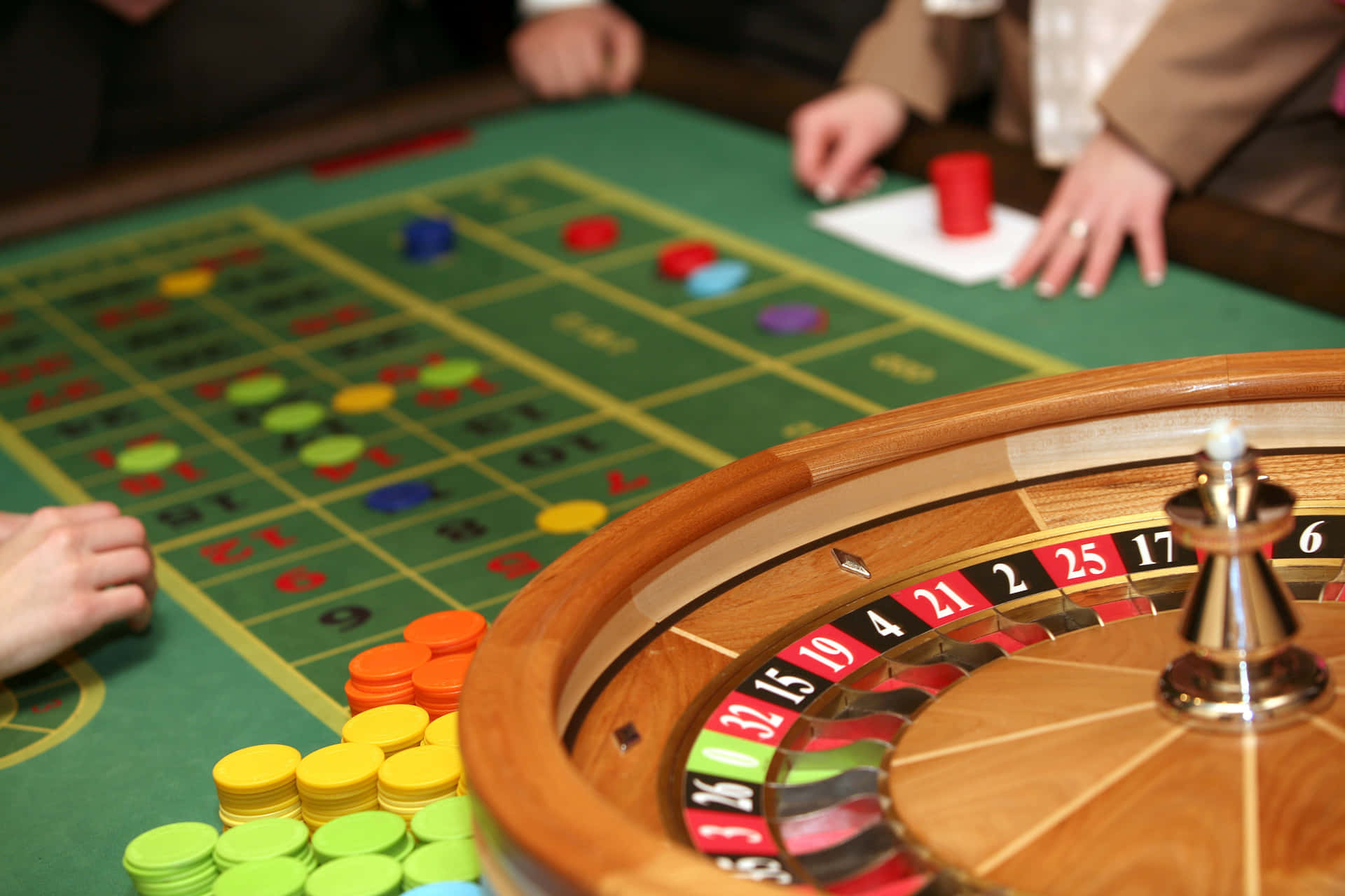 Casino Roulette Table With Chips Wallpaper