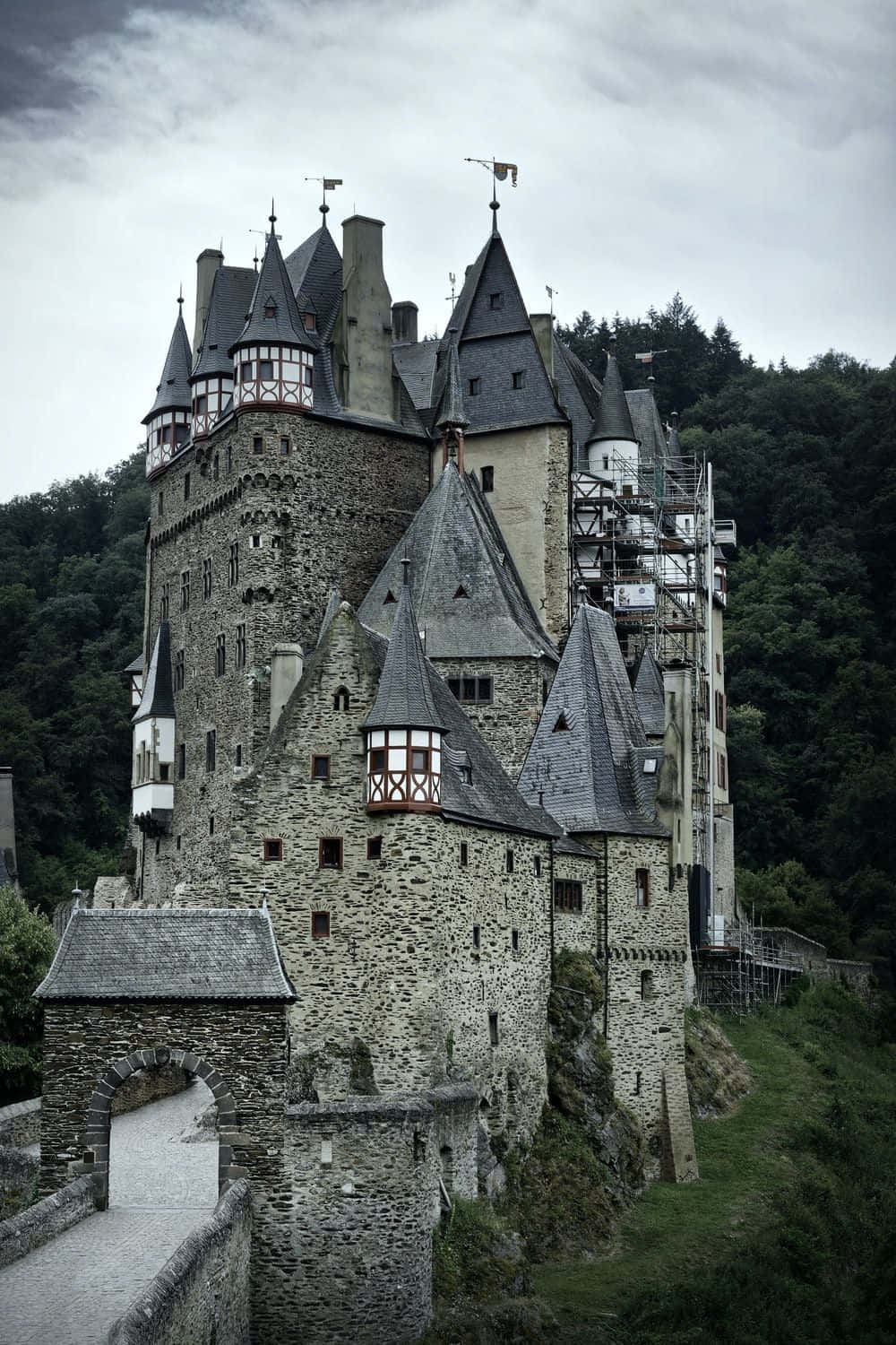 a castle with a large tower on top of it Wallpaper