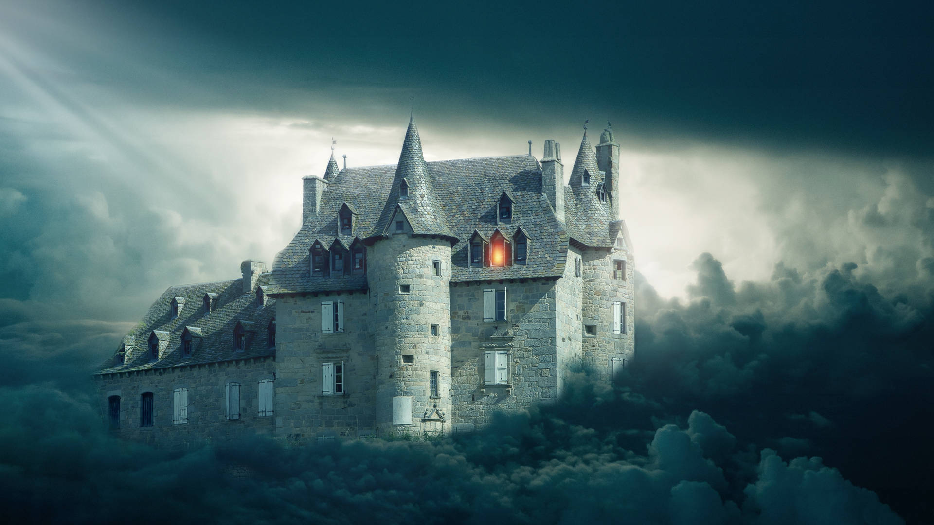 A Gloomy and Mystical Castle Surrounded By Clouds Wallpaper
