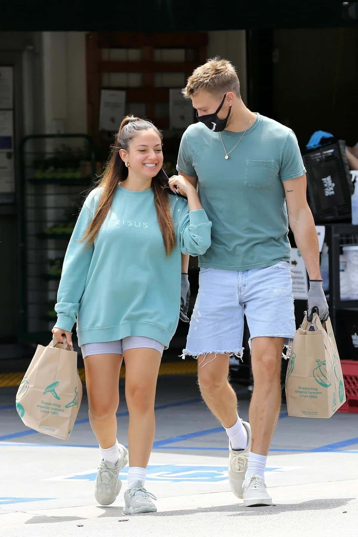 Casual Couple Grocery Shopping Day Wallpaper