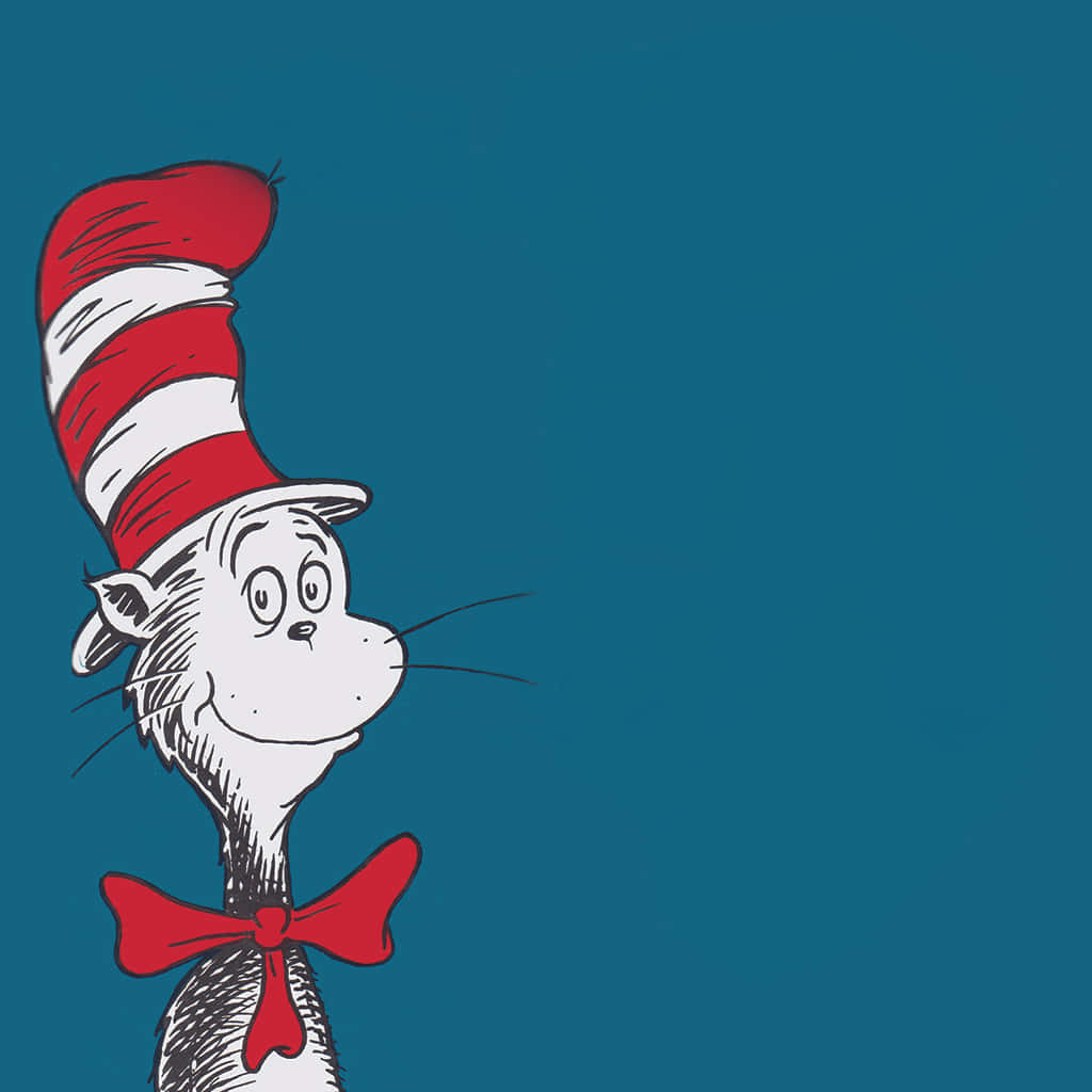 A Cat In The Hat Is Standing On A Blue Background