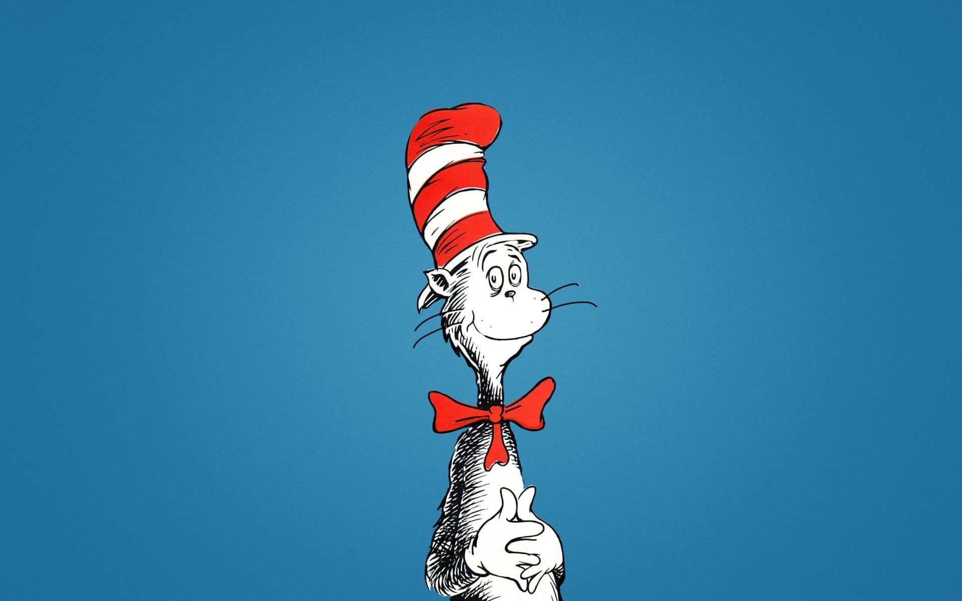 A Cat In The Hat Is Standing Up On A Blue Background