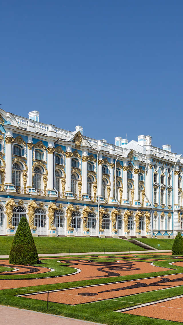 The Glorious Catherine Palace Nestled in Verdant Greenery Wallpaper