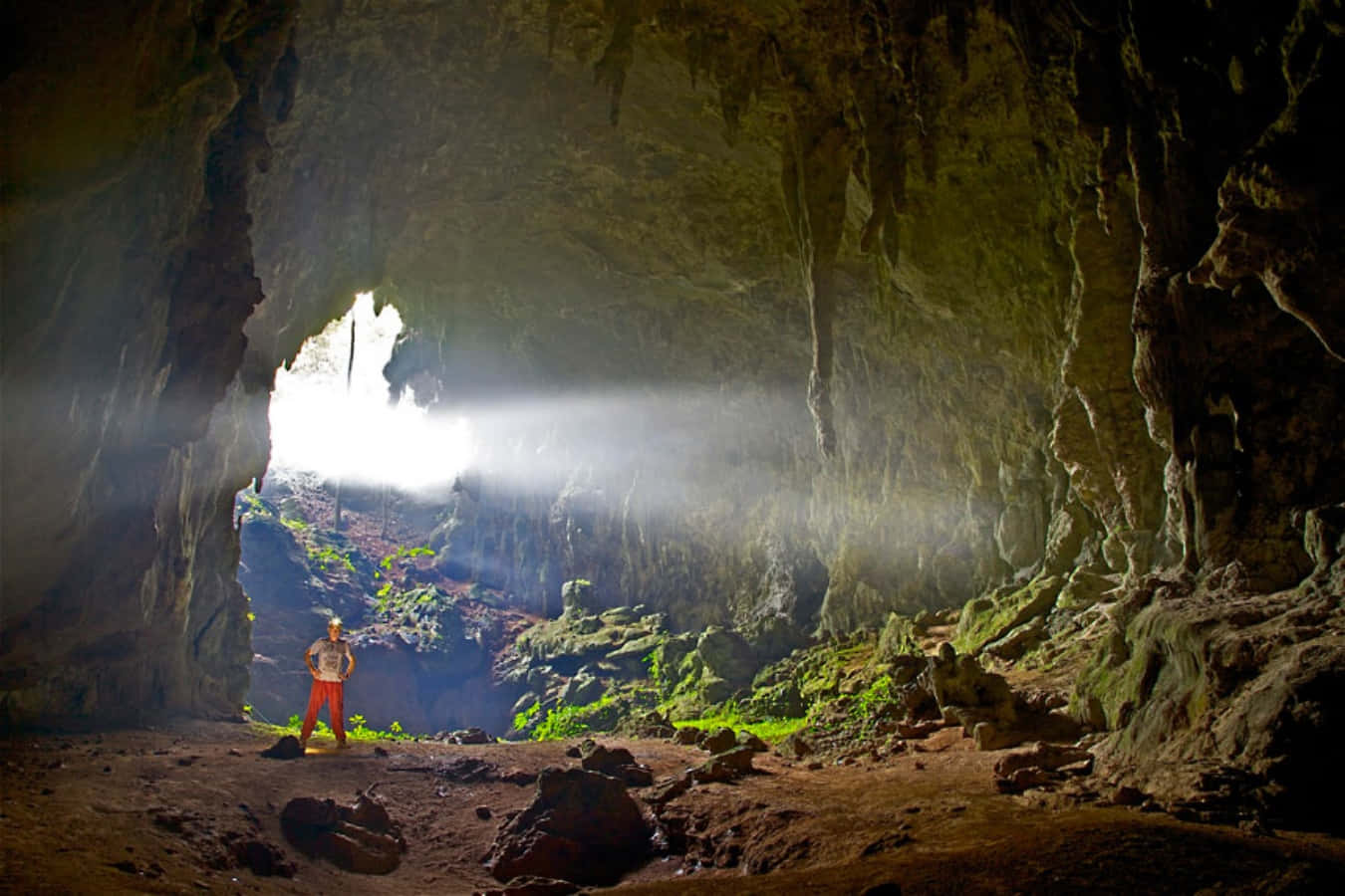 Majestic Cave Entrance Illuminated by Sunrays