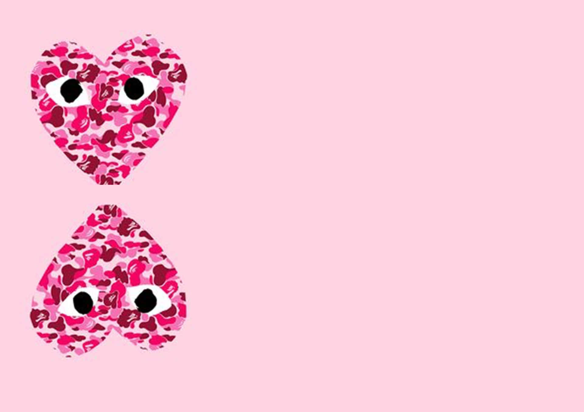 Download Two Pink Hearts With Eyes On A Pink Background Wallpaper