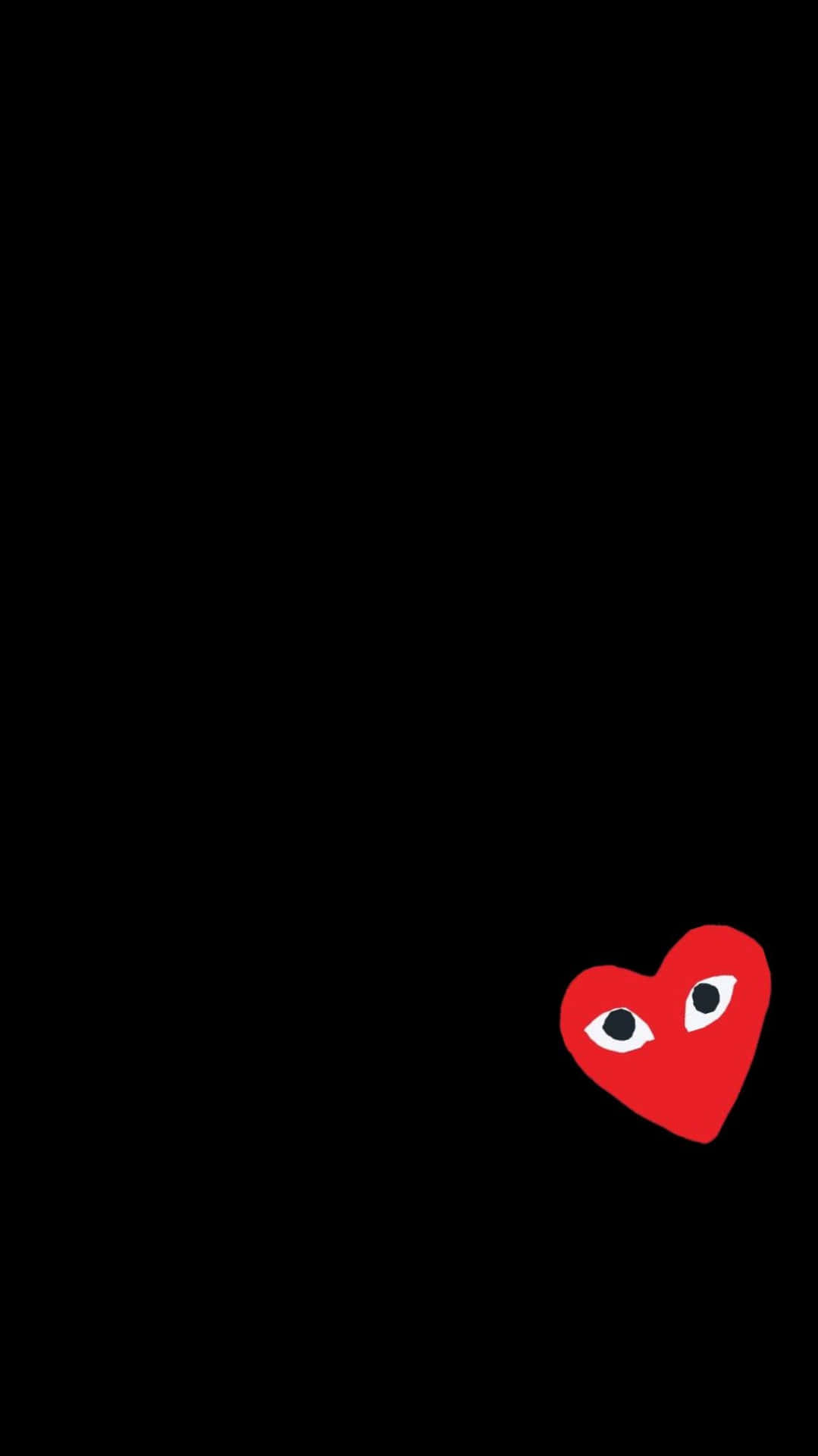 A Red Heart With Eyes On A Black Background Wallpaper