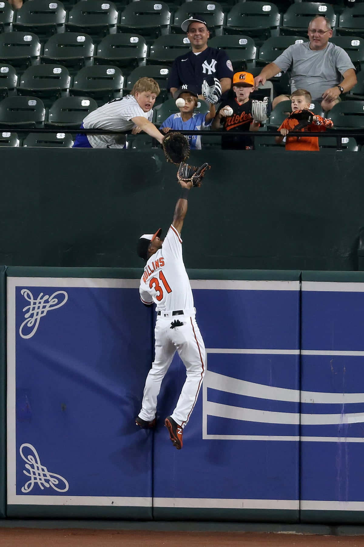 Cedric Mullins Making A Catch At The Wall Wallpaper