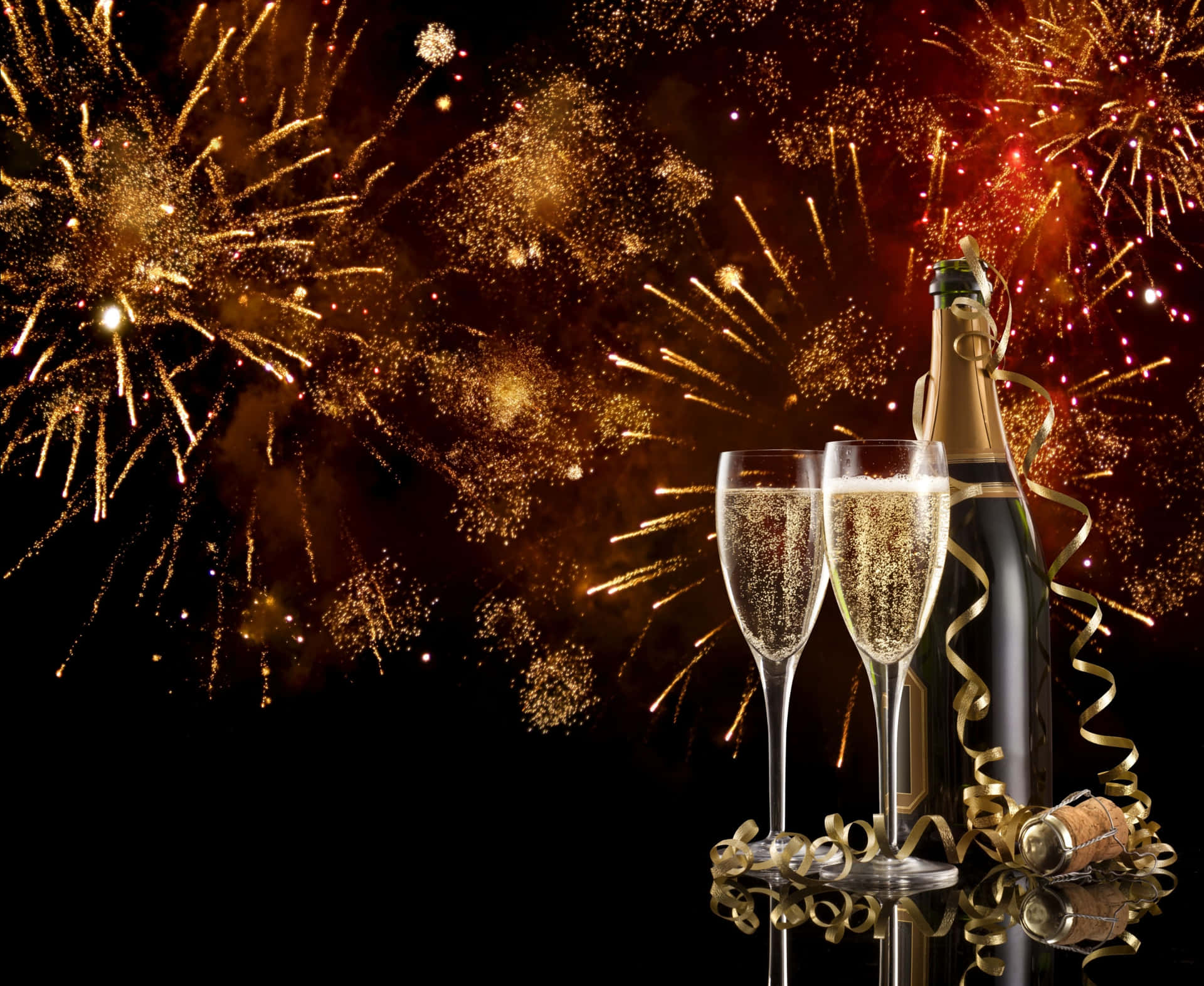Champagne Bottle And Glasses With Fireworks