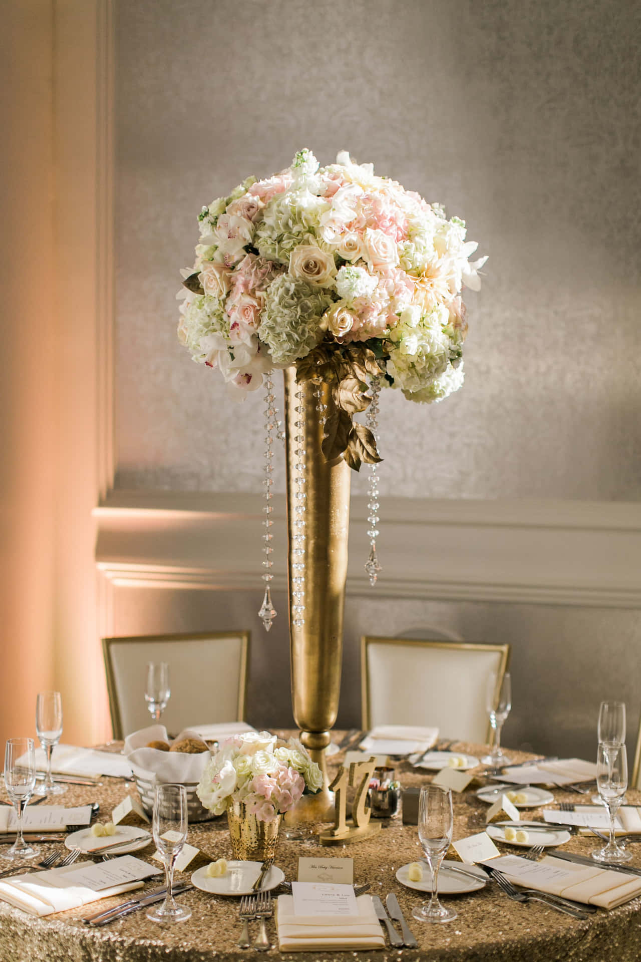 Breathtaking Floral Centerpiece with Glowing Candles" Wallpaper
