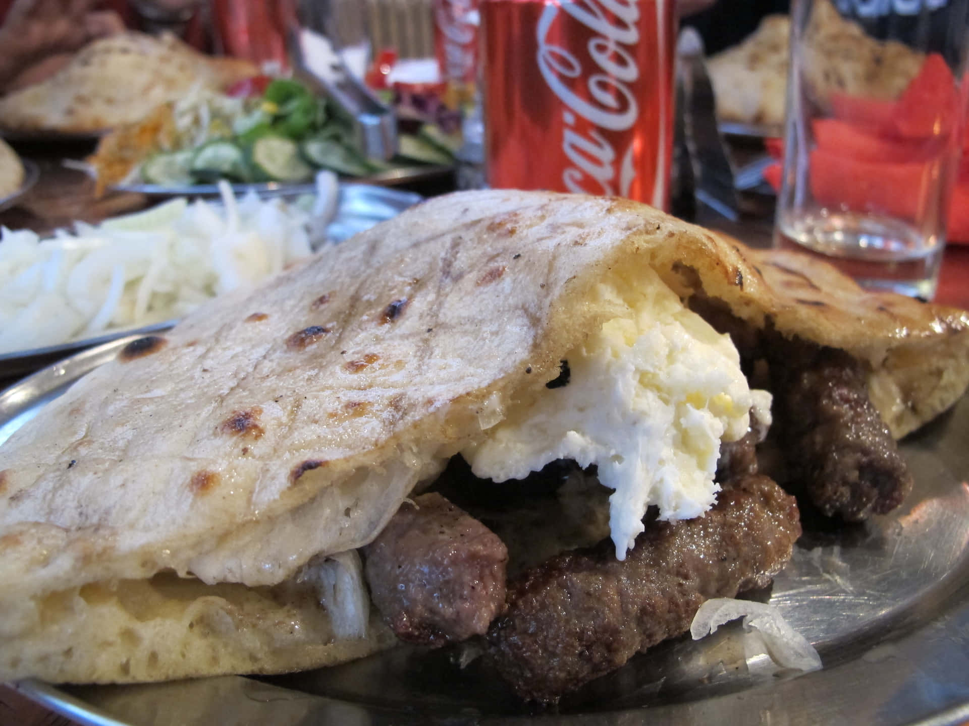 Traditional Cevapi Sausages Paired with Refreshing Coca-Cola Wallpaper