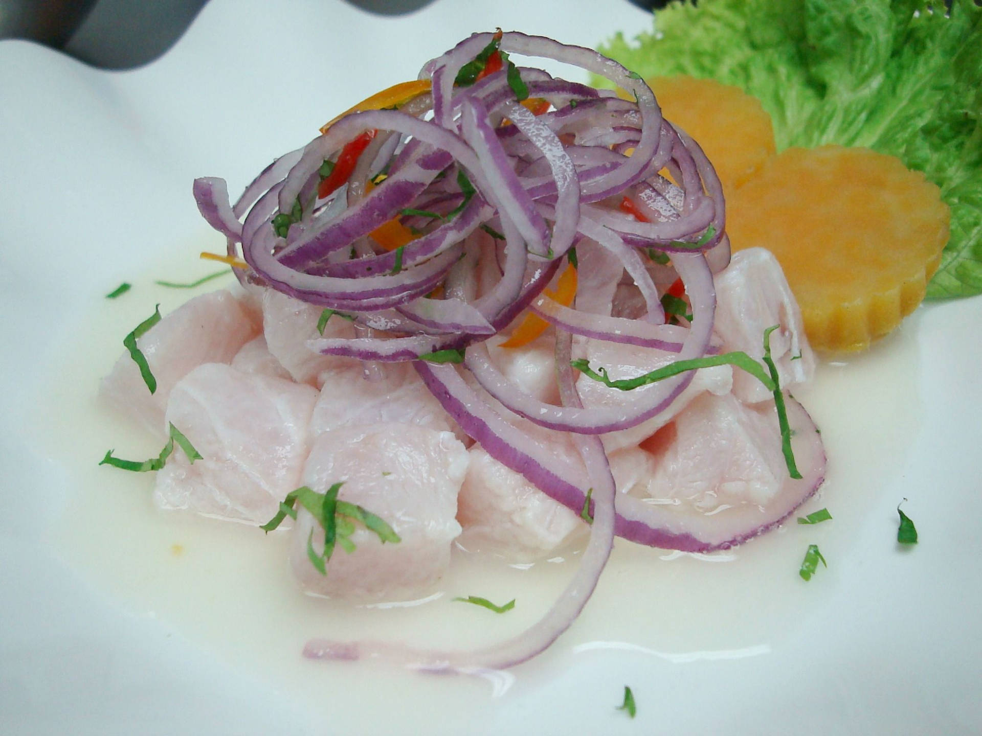 Ceviche Fish Topped With Onion Strips Wallpaper
