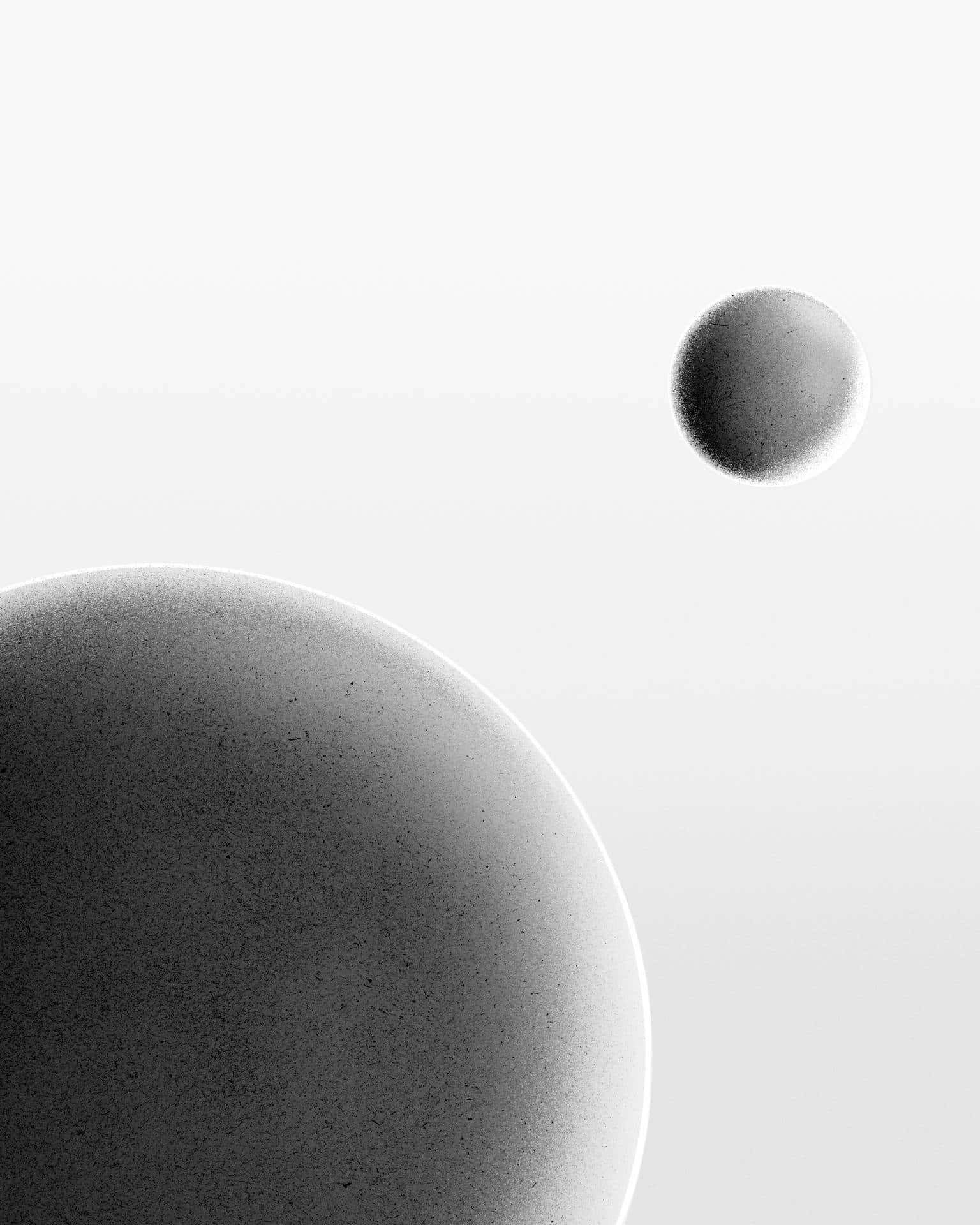 A Black And White Image Of Two Spheres