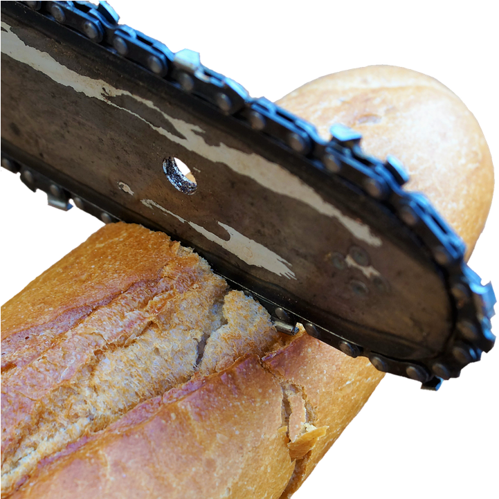 Chainsaw Cutting Bread PNG — A rusty chainsaw blade cuts through a crusty baguette with dramatic contrast against a black background.