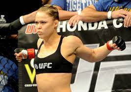 Champion In Action – Ronda Rousey In Fighting Pose Wallpaper