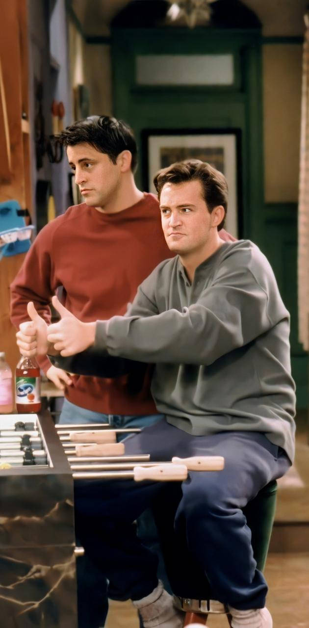 Chandler Thumbs Up Friends TV Show Wallpaper