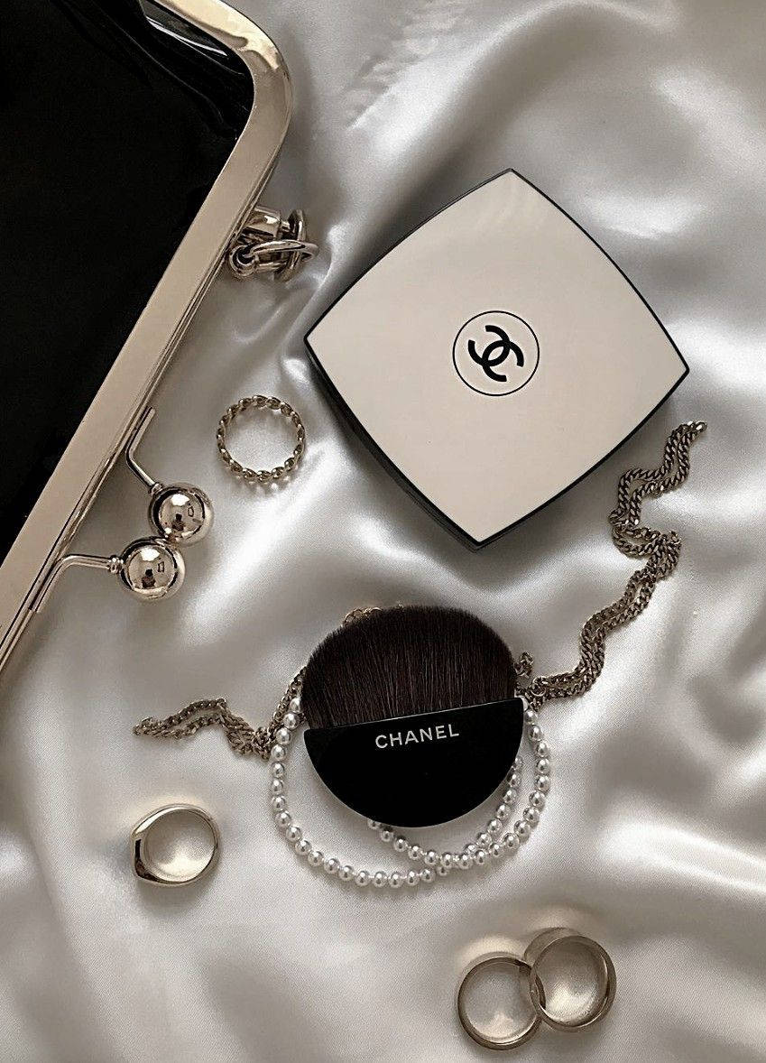 Bring sophisticated elegance to your space with this luxury Chanel aesthetic wallpaper. Wallpaper