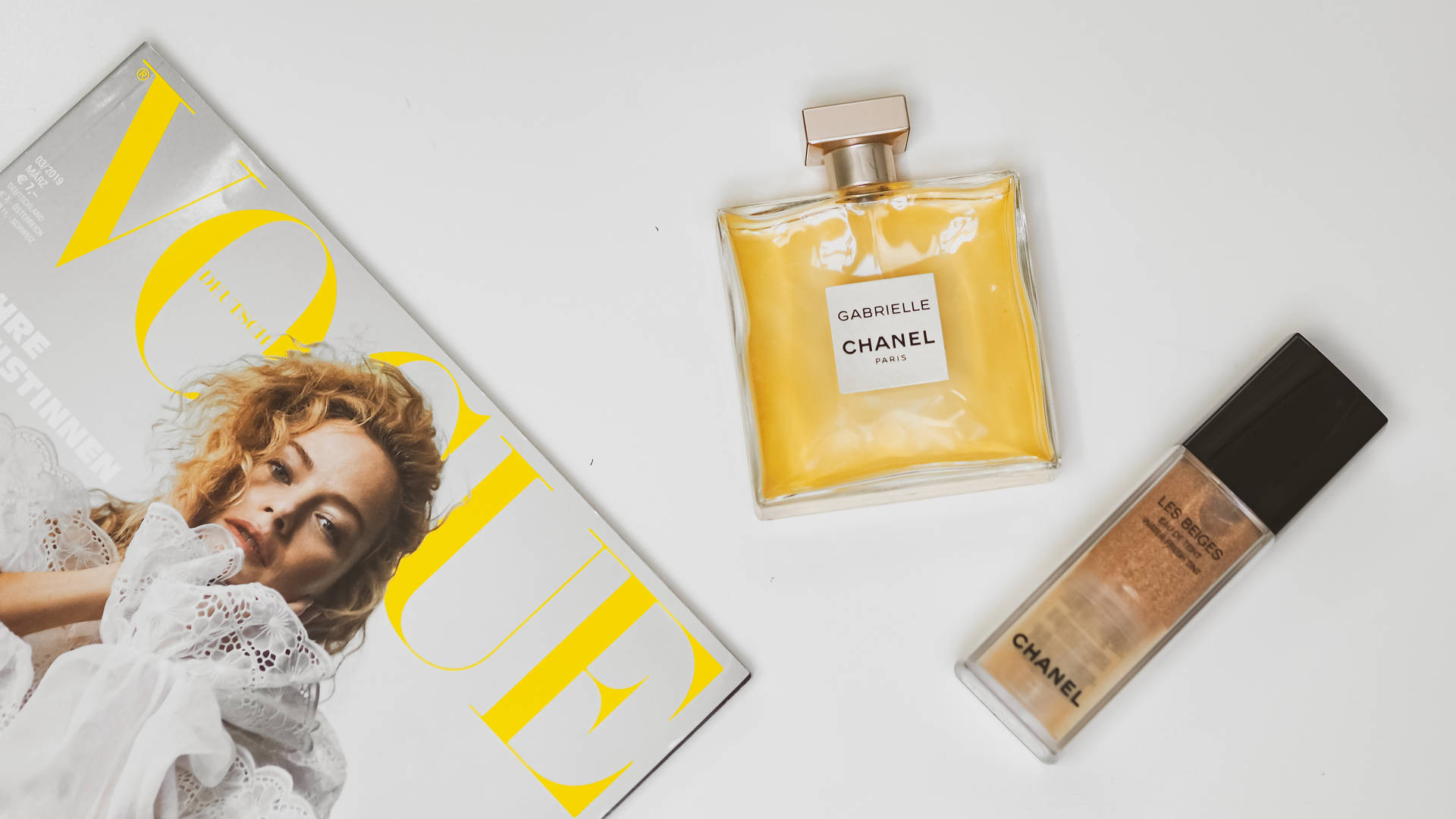 Chanel Cosmetics And Magazine Background