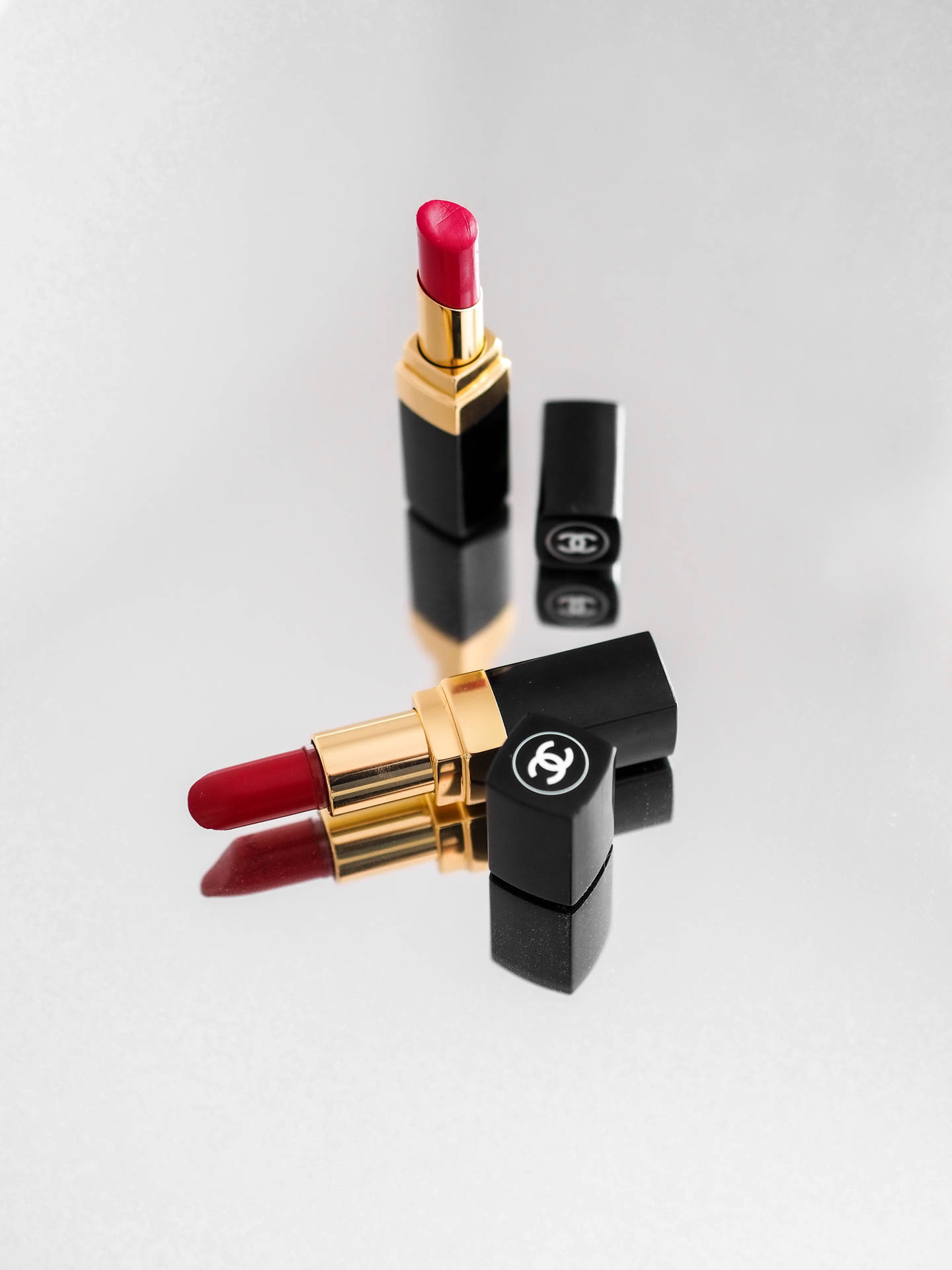 Chanel Red Lipsticks Mirror Reflection Background