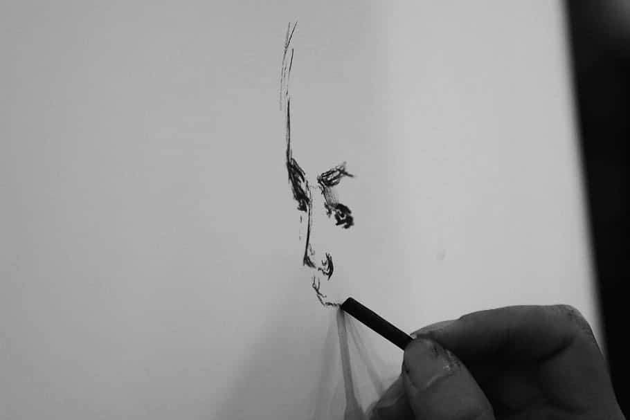 Captivating Charcoal Drawing of a Mysterious Woman Wallpaper