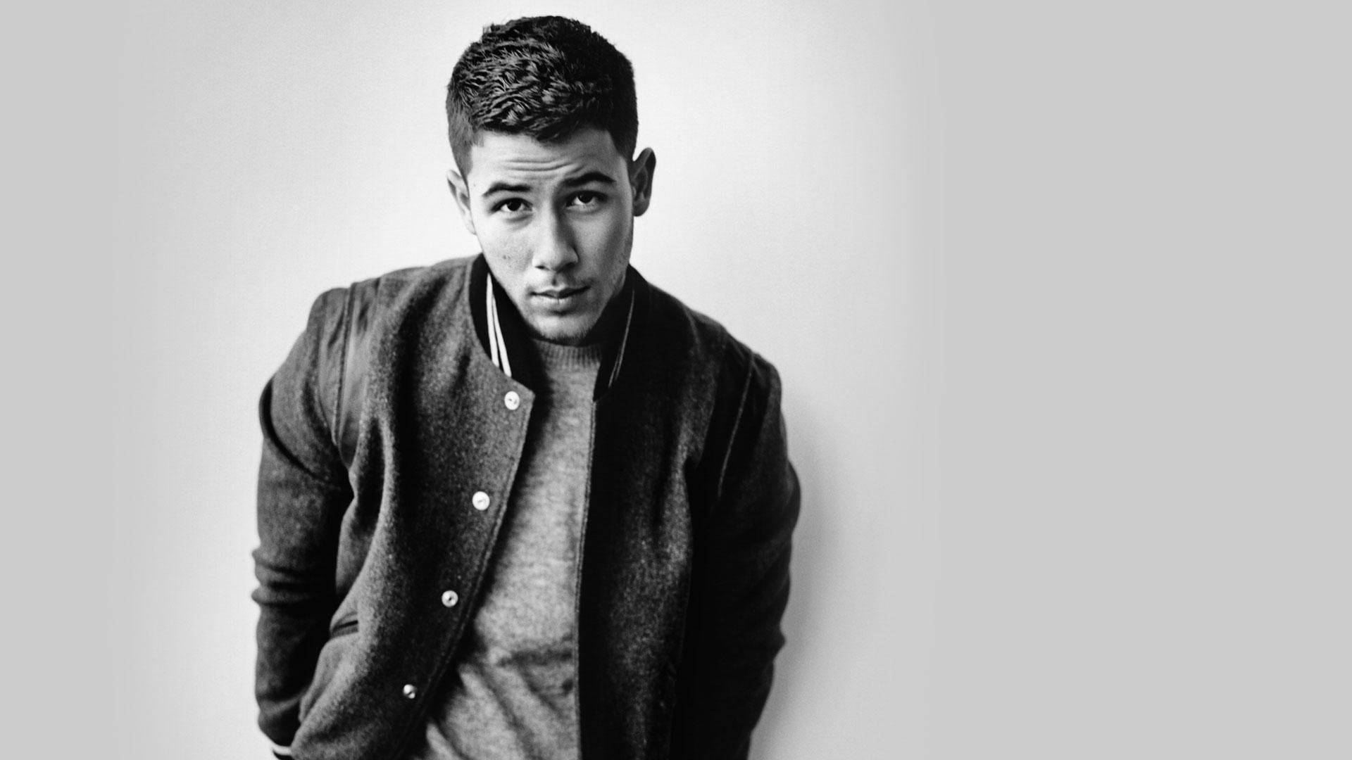 Charmerende sanger Nick Jonas Detaljer om en spændende chic tapet Wallpaper