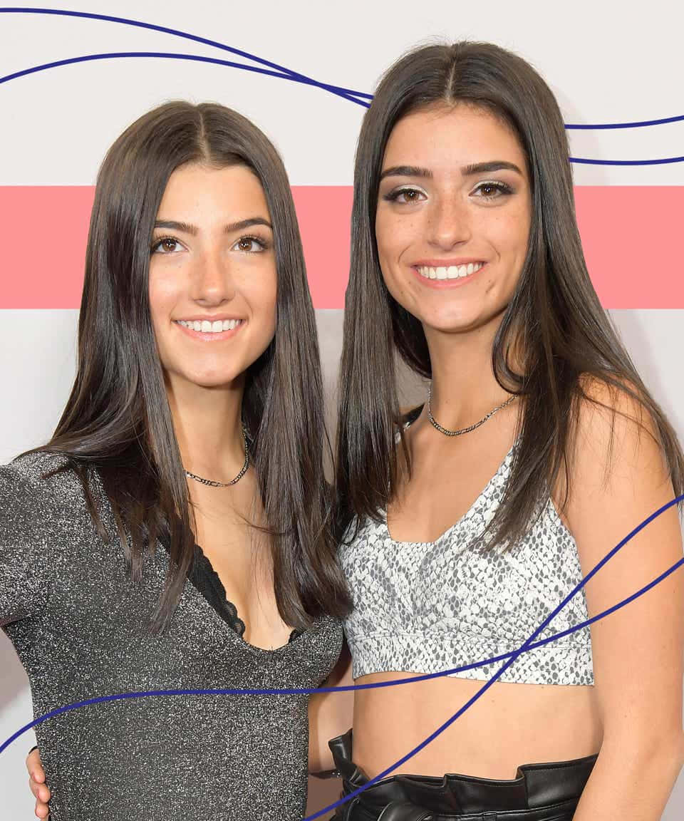 Two Women Standing Next To Each Other With A Pink And Blue Background Wallpaper
