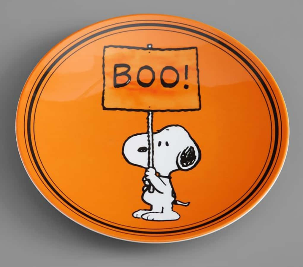 A Plate With A Snoopy Holding A Boo Sign