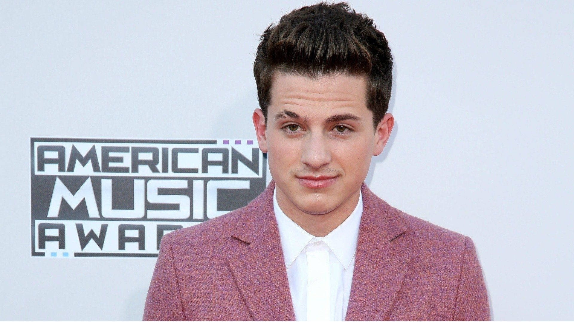 Charlie Puth On Red Carpet Background